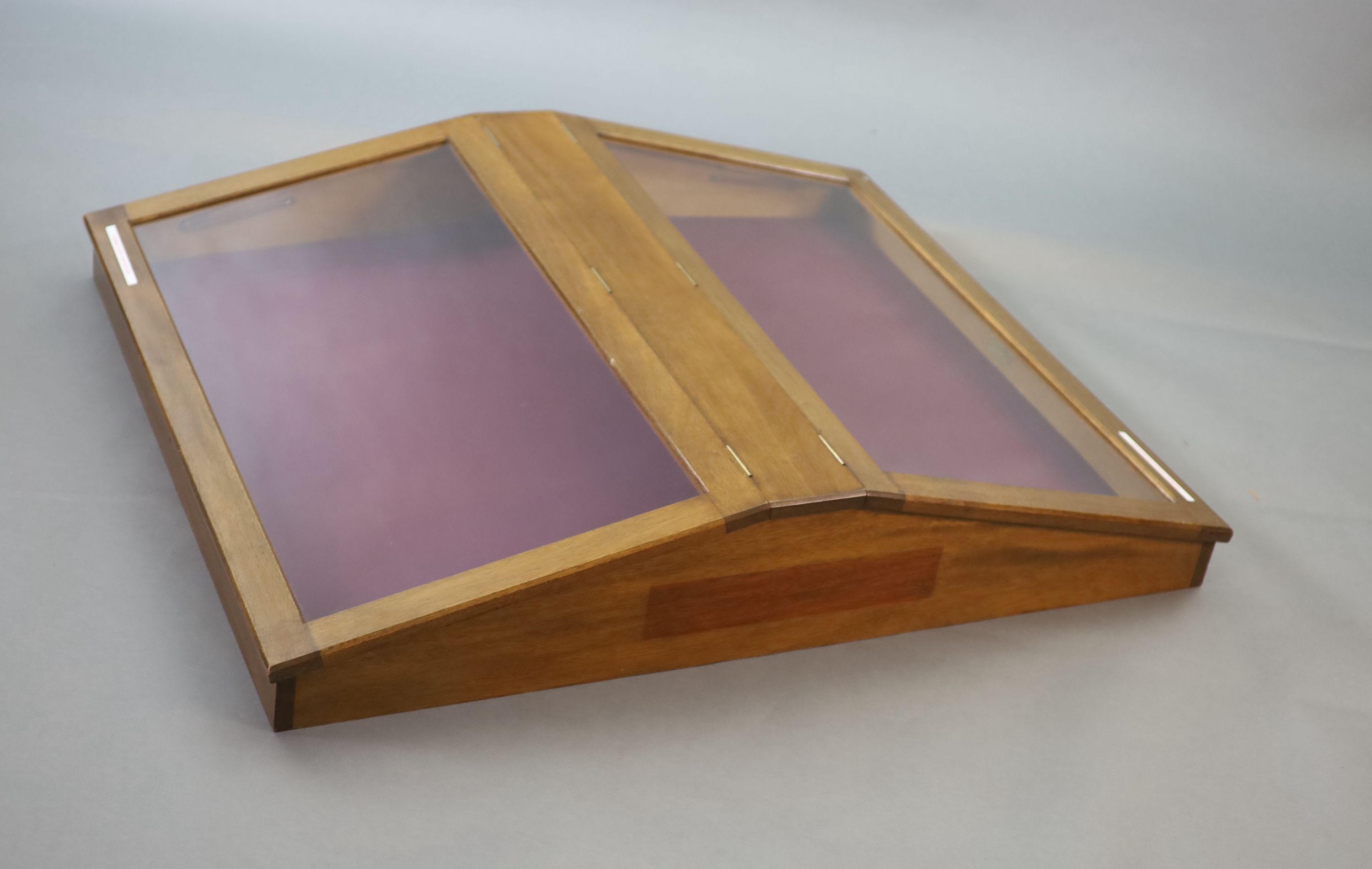 A 20th century teak table top double display case, from the Library of the Royal College of Surgeons, width 103cm depth 128cm height 108cm